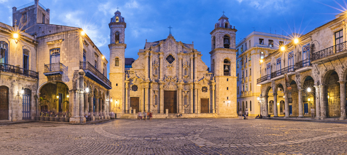 Historic colonial buildings in Old Havana. Panoramic view of Havana Cathedral against sky.